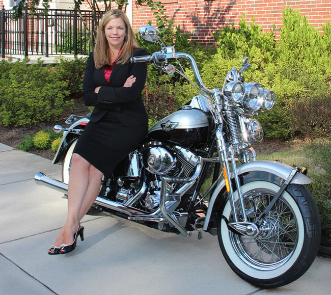 Stefanie Drake Burford Leaning Against A Motorbike